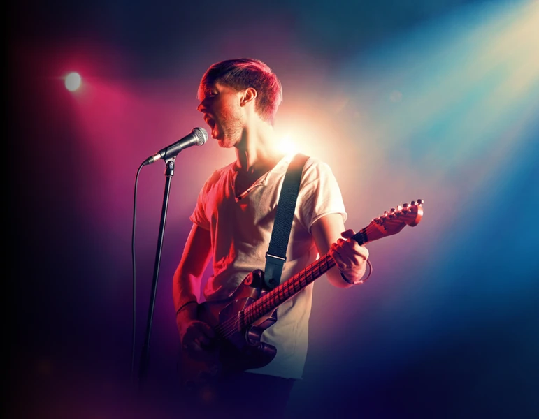 rock singer with a guitar in stage